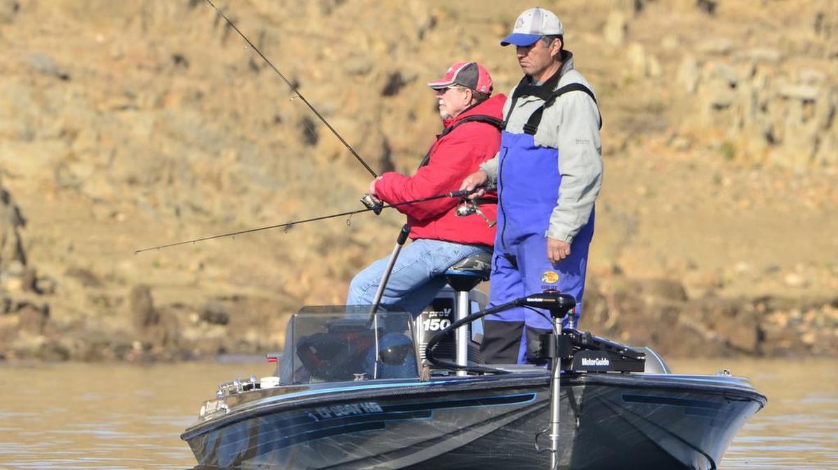 Bass fishermen Tom Sauerbrei, left, and John Albidrez, right, patiently fish in a Millerton Lake cove during a 2012 tournament.