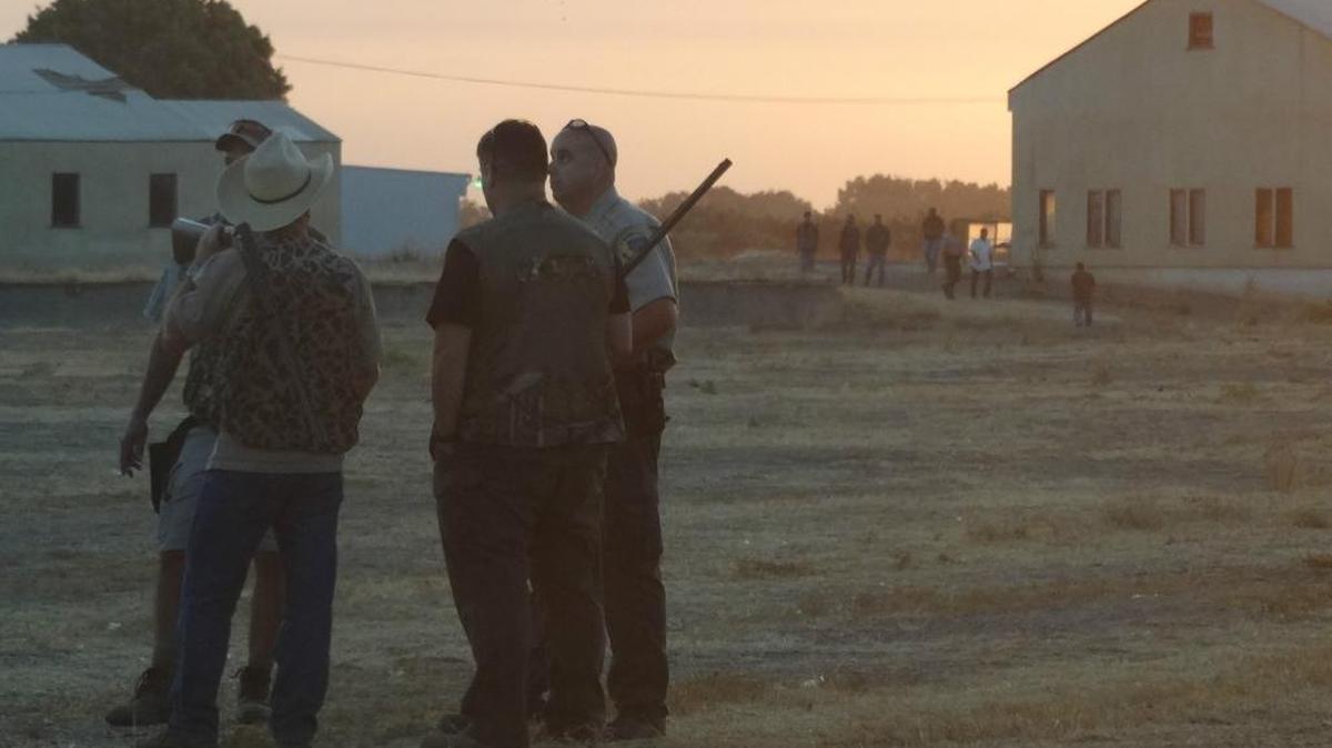 
Lt. Doug Barnhart of the California Department of Fish and Wildlife talks to hunters cited for hunting dove over a baited area. In all, 31 people were cited for poaching during the dove season-opener early Tuesday at the old Lemoore Army Air Field.
