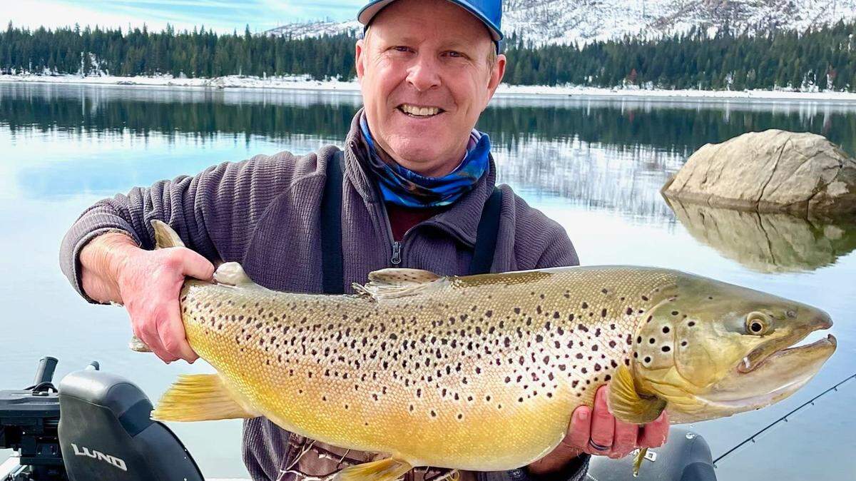 Byron Stickler of Fresno took a quick photo of an 18-pound, 5-ounce brown trout before a successful release back in Shaver Lake.