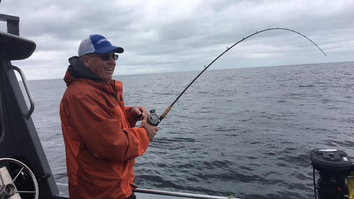 Fish on! Roger George fights a halibut on Day 2 of his Alaskan fishing adventure in the sea near Sitka.
