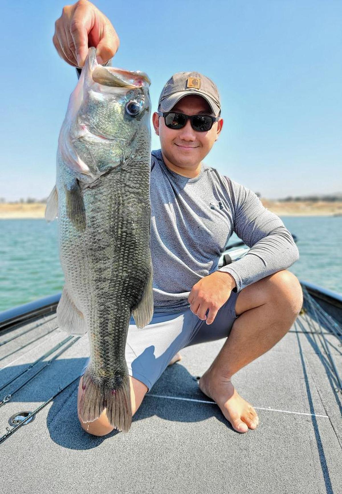 Jerry Xiong of Clovis shows off a 5.3-pound bass caught at Hensley Lake with a Whopper Plopper lure.