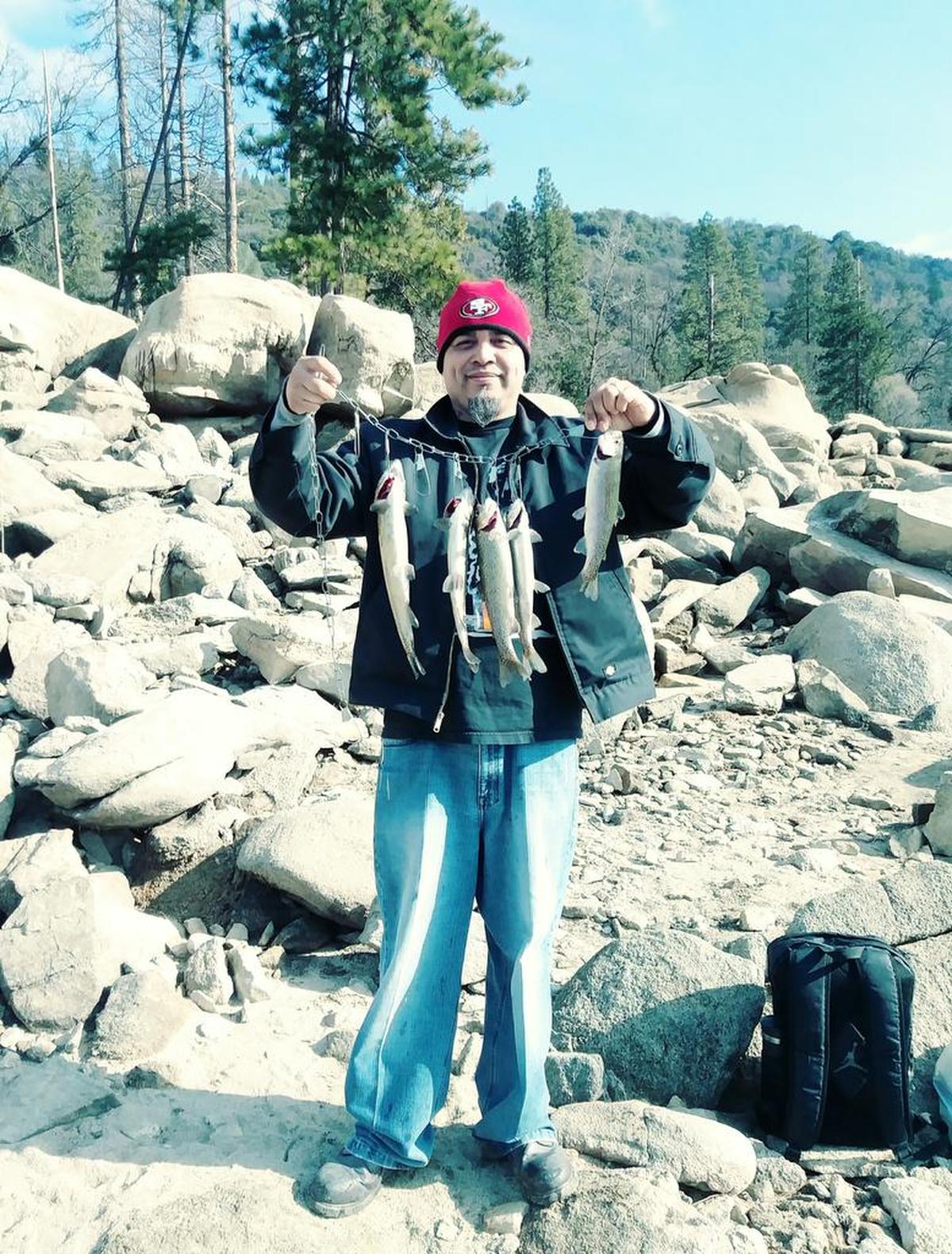 Joe Alvarado Jr. shows off his catch from Bass Lake on Saturday, Jan. 12.