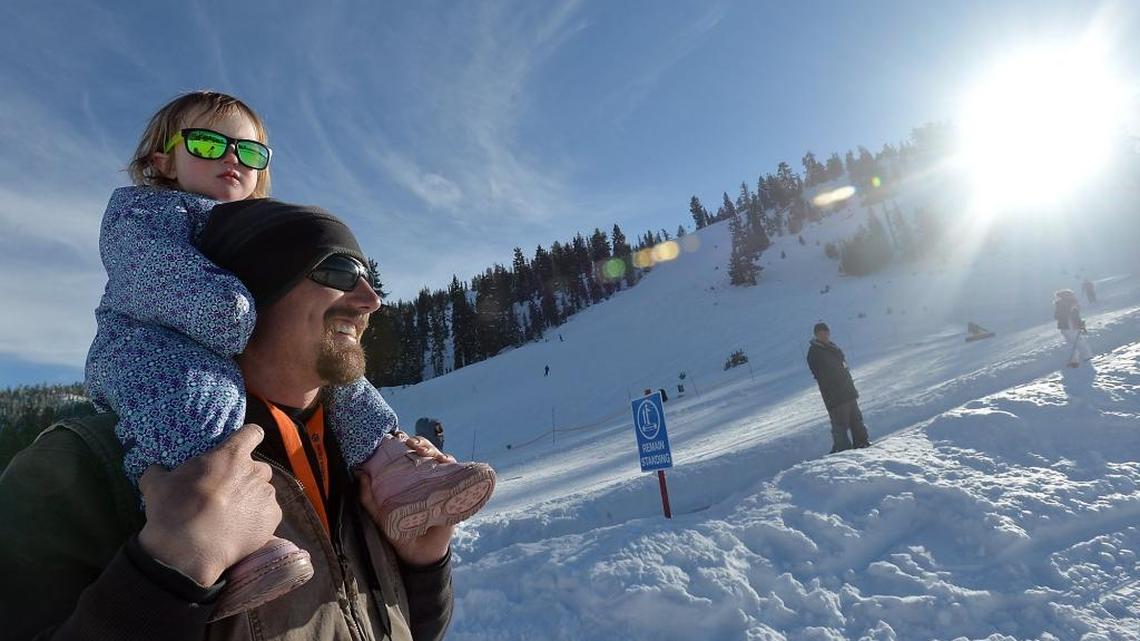 A young skier stays warm on top of dad’s shoulders while taking in the view on Dec. 27, 2015, at China Peak Mountain Resort near Huntington Lake. China Peak has received more than 300 inches of snow this season, and is expecting even more to fall ahead of the weekend.