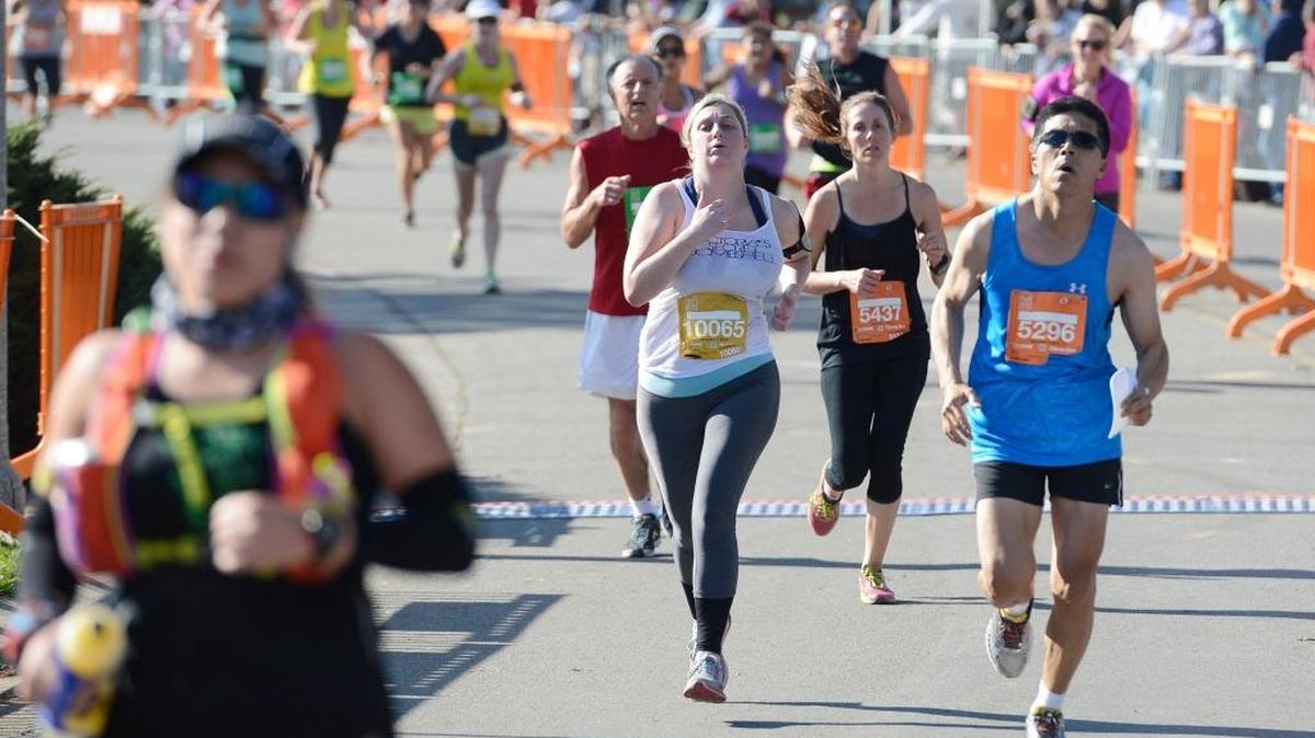 Runners approach the finish line during the 2015 Two Cities Marathon & Half at Woodward Park in Fresno. Only 150 days remain to shape up for the 2016 edition, which returns Nov. 6.