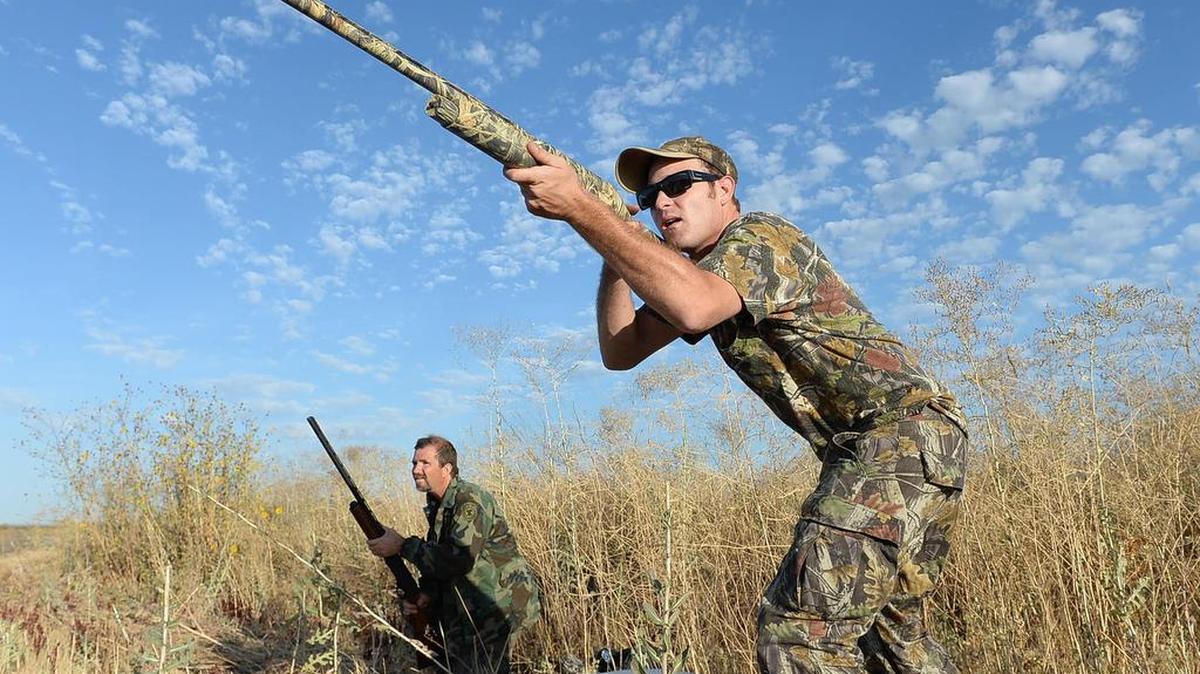 
David Bennett, left, and Jeremy Stubbs take aim at Mendota Wildlife Area on the opening day of dove season in 2013. The 2015 dove opener is Tuesday, Sept. 1.
