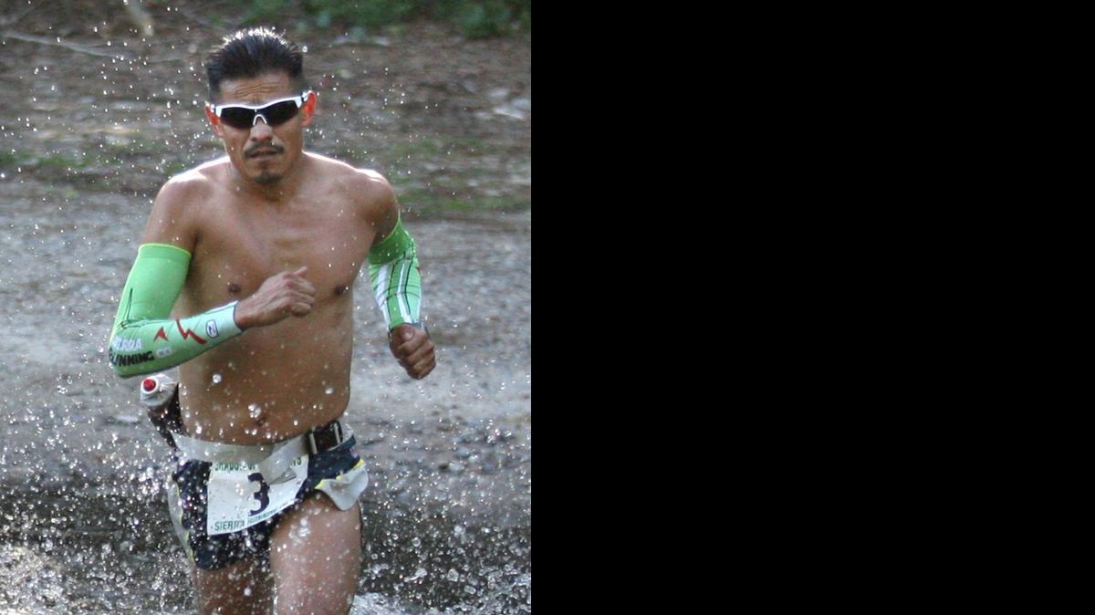 
Oswaldo Lopez, seen here crossing a stream during the Shadow of the Giants 50K ultramarathon in 2012, will run in the AdventureCORPS Badwater Ultramarathon next week. The 135-mile footrace starts at Badwater Basin and features 14,600 feet of elevation gain to the finish line at Whitney Portal.
