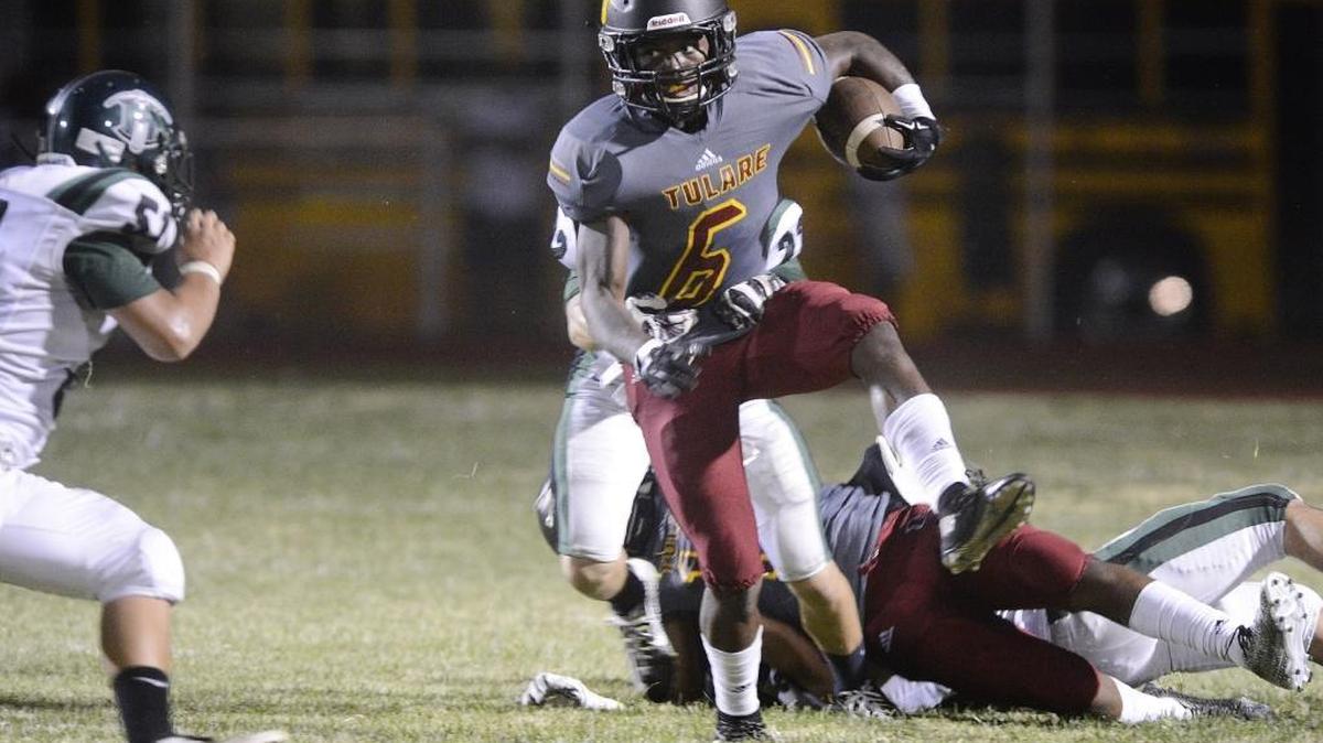 
Tulare’s Romello Harris, pictured in a 41-14 win over El Diamante on Thursday, Aug. 27, 2015, had a broken finger surgically repaired Monday and could return as soon as the team’s next game, at home against Dinuba on Oct. 2.
