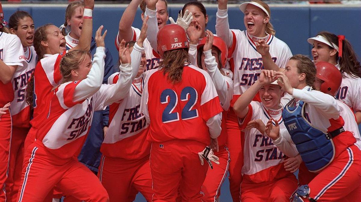Nina Lindenberg is greeted by teammates at home plate after hitting a home run during the Fresno State softball team’s national championship run. This home run was a two-run shot against Cal to win the NCAA Regional championship. Lindenberg will be inducted into the Fresno Athletic Hall of Fame on Thursday, Nov. 12, 2015.