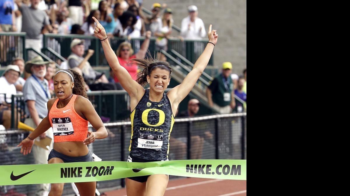 
Jenna Prandini, right, raises her arms in triumph after winning the 200 on Sunday at the U.S. Track and Field Championships in Eugene, Ore.
