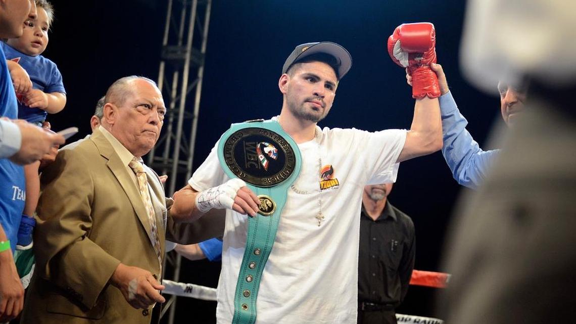 Jose Ramirez, center, an Avenal native and Fresno resident, celebrates a successful defense of his WBC Continental Americas title against Tomas Mendez of the Dominican Republic in a July 9, 2016, bout at Tachi Palace Hotel and Casino. Ramirez returns to the ring on the “Fight for Water 6” card on Dec. 2 at Save Mart Center.