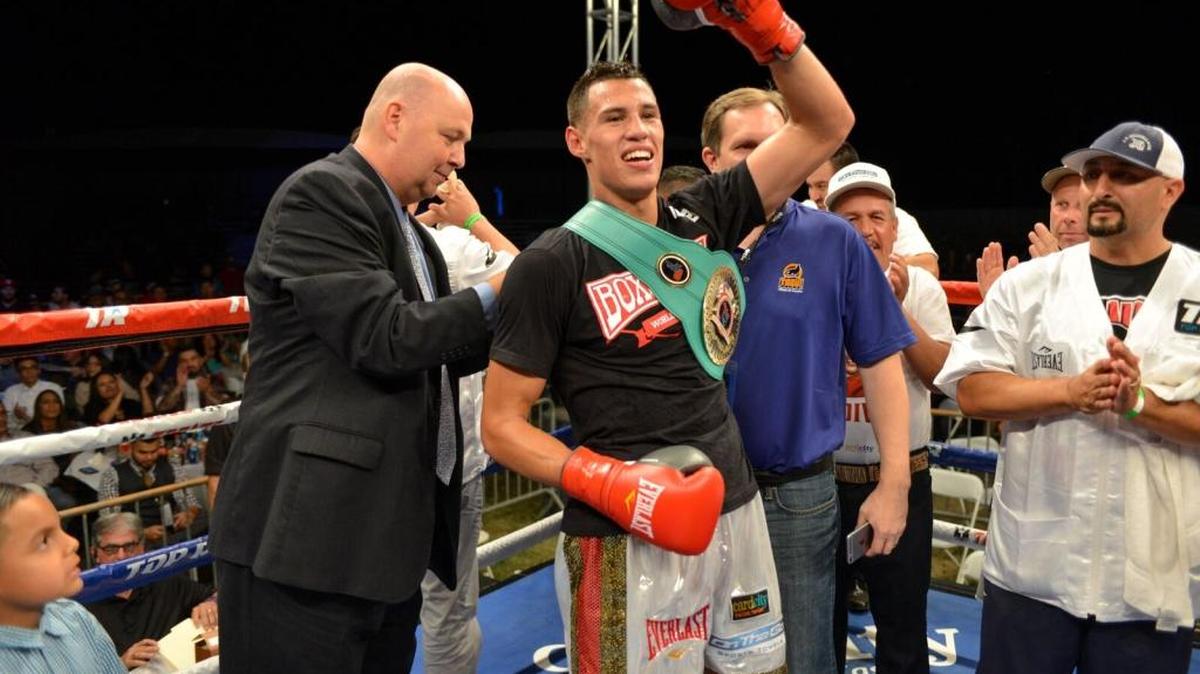 
Daniel Valdivia celebrates after capturing the NABF junior super welterweight champion title with a sixth-round technical knockout over Jeremy Ramos at Tachi Palace Hotel & Casino in Lemoore.
