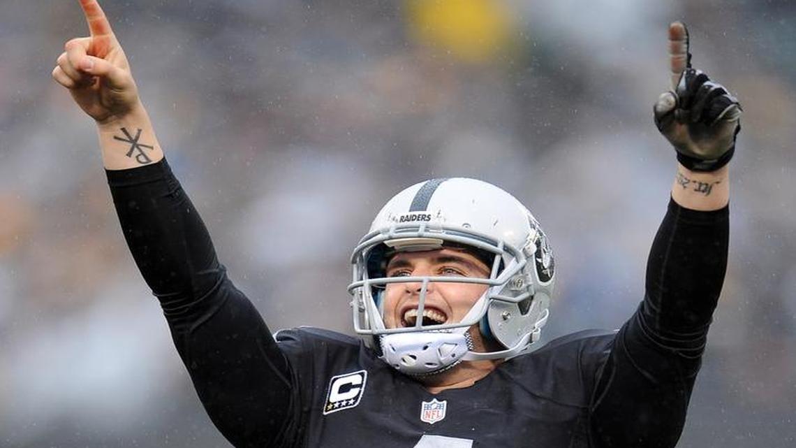 Oakland Raiders quarterback Derek Carr wears No. 4 as homage to his boyhood NFL idol, Brett Favre.