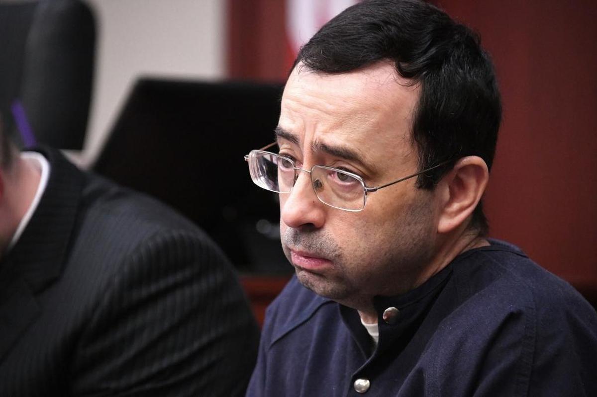 Larry Nassar looks at the gallery in the court during his sentencing hearing in July 2017. The former sports doctor who admitted molesting some of the nation’s top gymnasts for years was sentenced to 40 to 175 years in prison as the judge declared: “I just signed your death warrant.”
