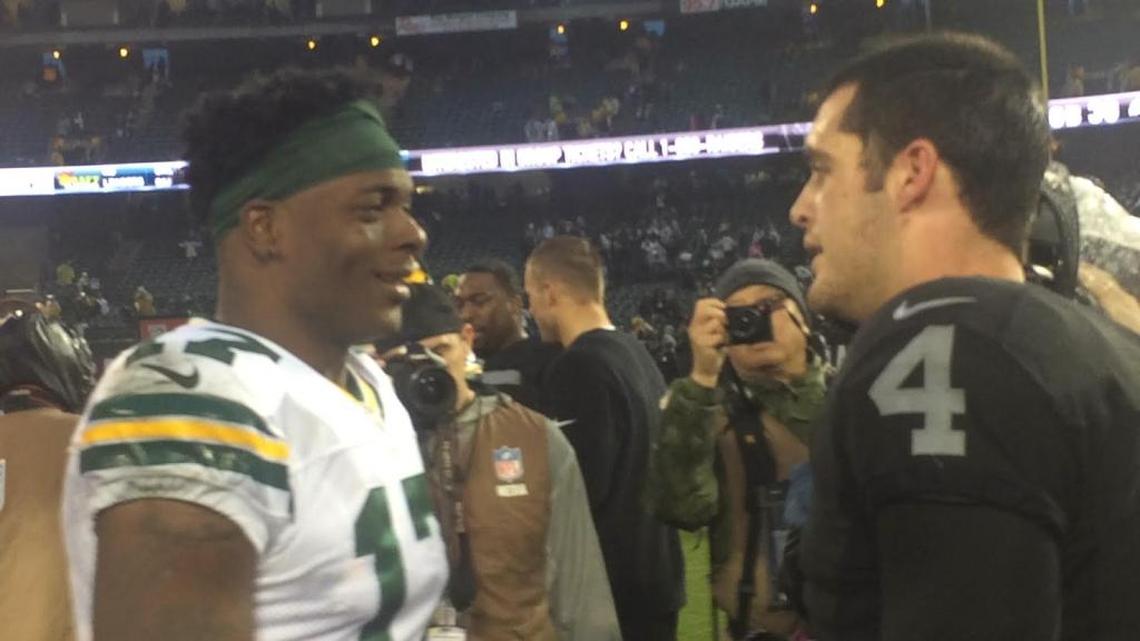 Davante Adams and Derek Carr meet at midfield after an NFL game on Sunday, Dec. 20, 2015. The duo are teammates once again after the Raiders acquired Adams from the Green Bay Packers, reuniting the former Fresno State stars.