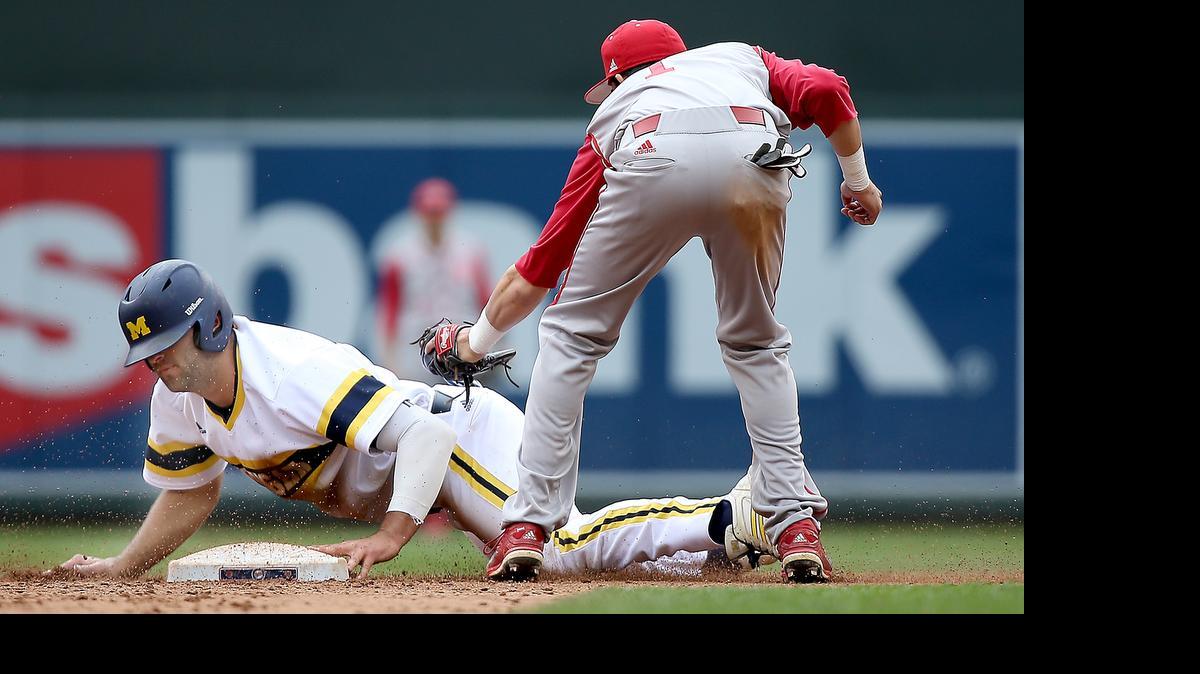 
Michigan’s Jackson Glines slides safely into second base despite Indiana’s Casey Rodriguez efforts during the sixth inning of the Big Ten baseball tournament on May 20.
