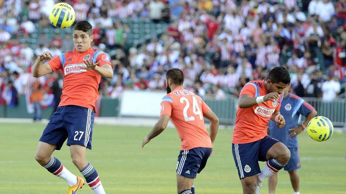 Players warm up before a Liga MX friendly match at Chukchansi Park Friday, July 10, 2015.