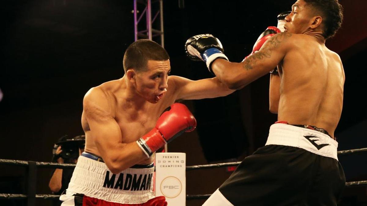 Marcos Hernandez of Fresno lands a punch against Thomas Hill on Tuesday, July 12, 2016. Hernandez earned a victory by unanimous decision to improve to 8-0.