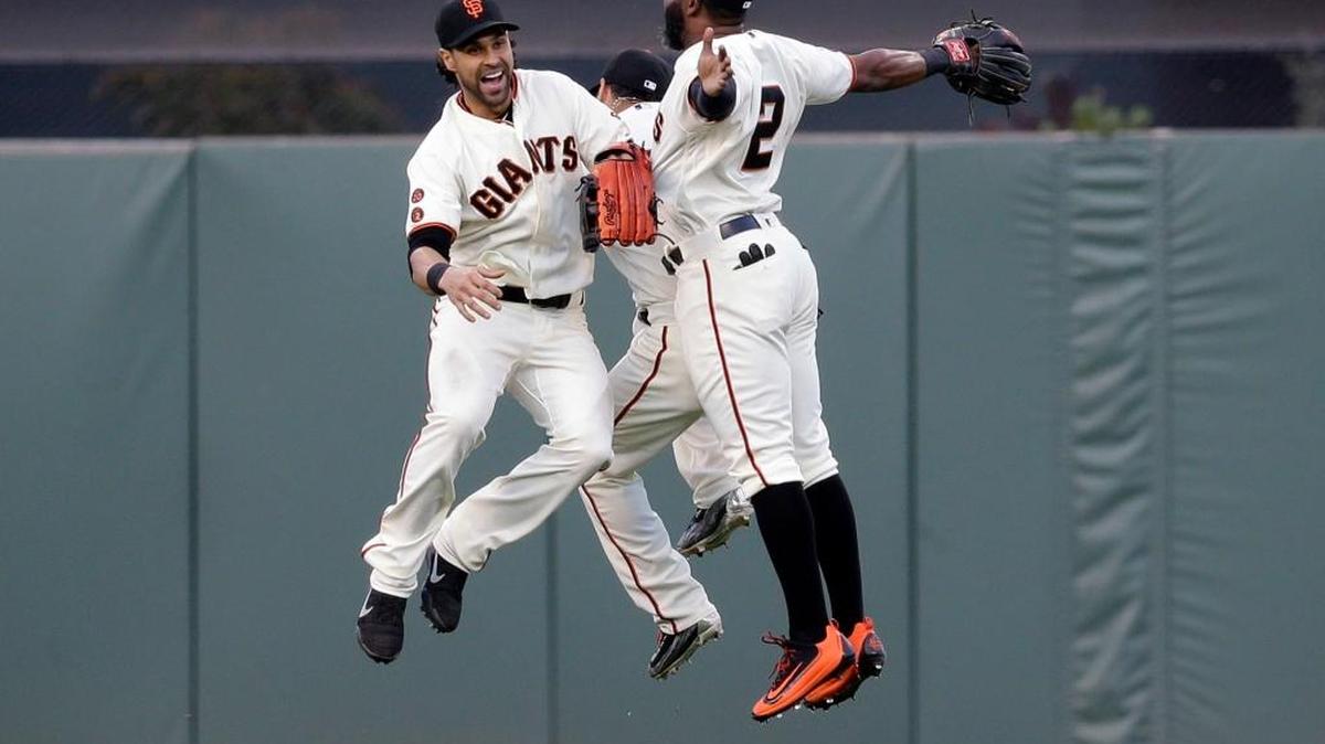 From left, San Francisco Giants outfielders Angel Pagan, Gregor Blanco, and Denard Span celebrate after a 1-0 win over the Chicago Cubs during a baseball game, Sunday, May 22, 2016, in San Francisco. The Giants took two of three games from the Cubs, who have the majors’ best record.