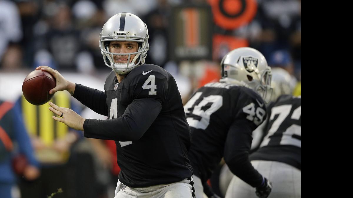 
Raiders quarterback Derek Carr passes against the Buffalo Bills last season. The former Fresno State star returns for his second season with the arrival of receivers Michael Crabtree and Amari Cooper, as well as coach Jack Del Rio. A new staff and additional upgrades made through free agency — combined with a foundation led by Carr and linebacker Khalil Mack — have given the Raiders more reasons for optimism than usual heading into training camp.

