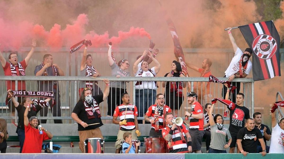 Fresno Fuego fans cheer and make some noise during a match against the OC Blues U23 at Chukchansi Park last summer. The Fuego open their PDL season May 6 against Burlingame FC at home.