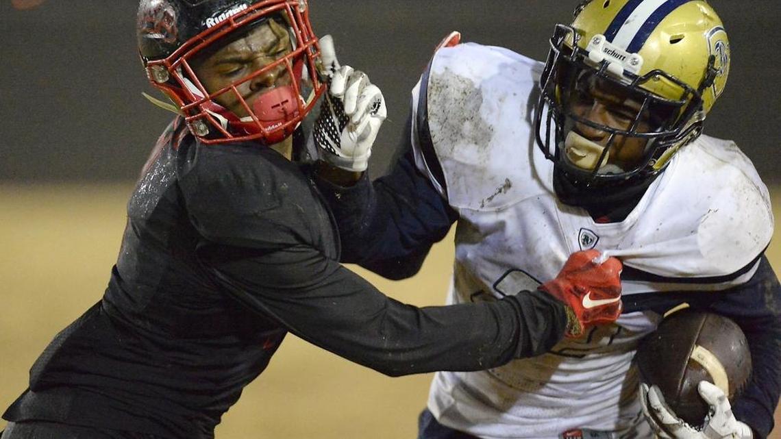 Hanford High’s Juwuane Hughes, left, tackles Bonita Vista’s Greg Bell in a CIF State Division IV-AA football championship game on Dec. 19. Hughes committed to Fresno State on Sunday.