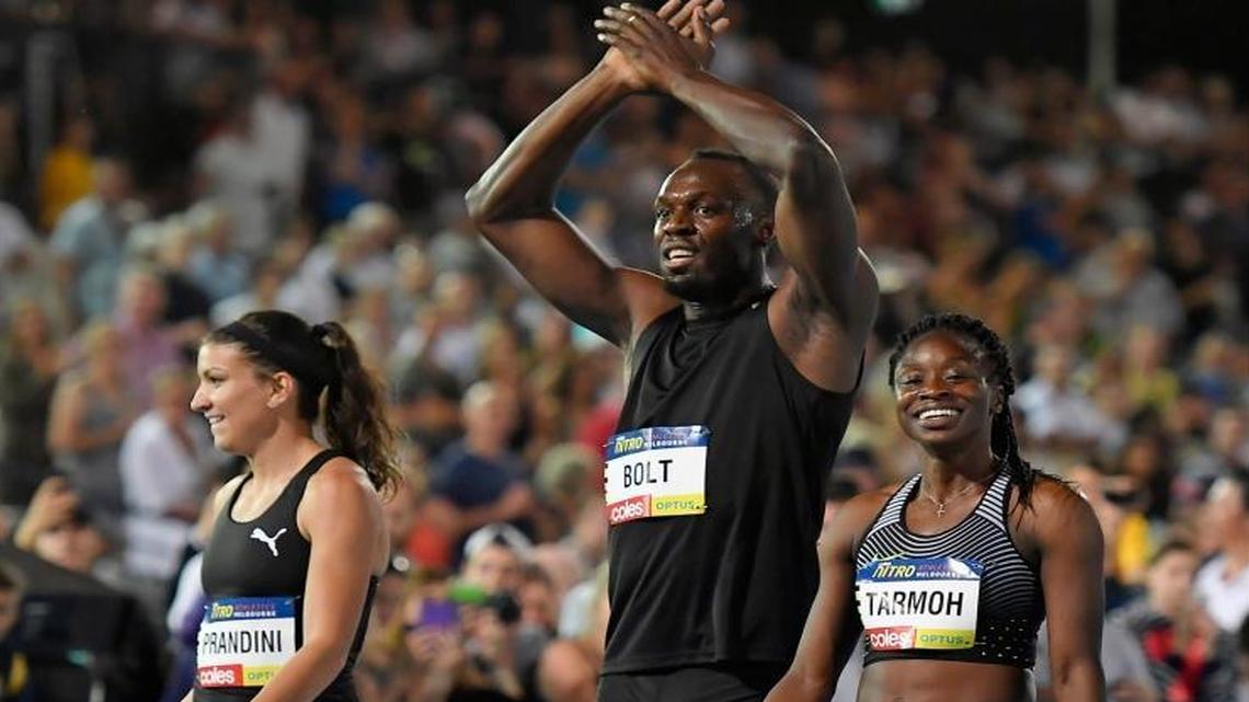 Jamaica’s Usain Bolt, center, celebrates with teammates Jenna Prandini, left, and American Jeneba Tarmoh after winning the mixed 4x100 mixed relay at the Nitro Athletics meet in Melbourne, Australia, Saturday, Feb. 4, 2017. Prandini is a former track standout at Clovis High.