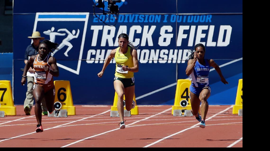 
Oregon's Jenna Prandini sprints down the track between Texas' Morolake Akinosun, left, and Kentucky's Dezerea Bryant on her way to winning the women’s 100 meters during the NCAA outdoor championships June 13, 2015, in Eugene, Oregon.

