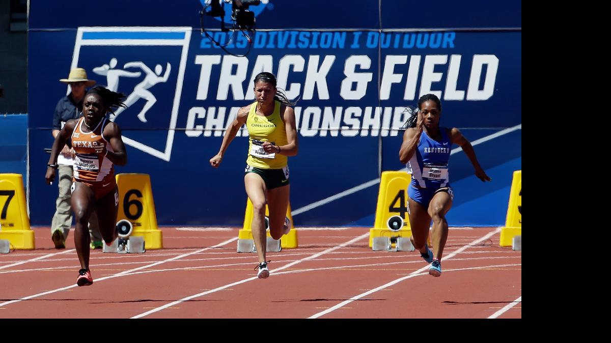
Oregon's Jenna Prandini sprints down the track between Texas' Morolake Akinosun, left, and Kentucky's Dezerea Bryant on her way to winning the women’s 100 meters during the NCAA outdoor championships June 13, 2015, in Eugene, Oregon.

