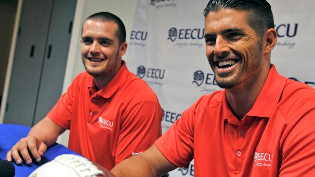 In a 2014 file photo, former Fresno State quarterbacks Derek Carr, left, and brother David Carr speak to the media after announcing their endorsement of Educational Employees Credit Union. They’ll share the stage in Modesto at a March 24 event.
