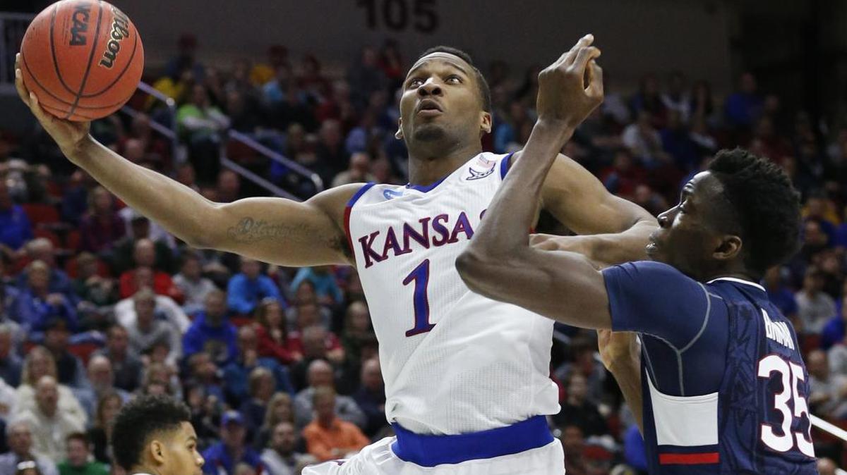 Kansas guard Wayne Selden Jr. (1) makes a shot in the second half against Connecticut's Amida Brimah (35) a second-round men’s college basketball game in the NCAA Tournament, Saturday, March 19, 2016, in Des Moines, Iowa.