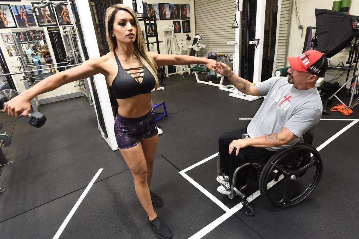 Lore Ceballos works out Thursday morning, April 26, 2018, with coach Sal Rivas in preparation for the Fresno Classic fitness competition in the bikini division, this Saturday at the Fresno Convention Center.