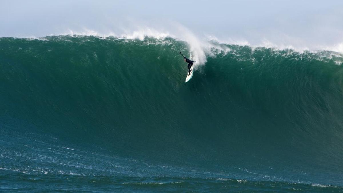 Surfer Derek Dunfee tackles a 30-foot wave at Mavericks in 2015. Big wave specialists gravitate to the break on the San Mateo County coast.