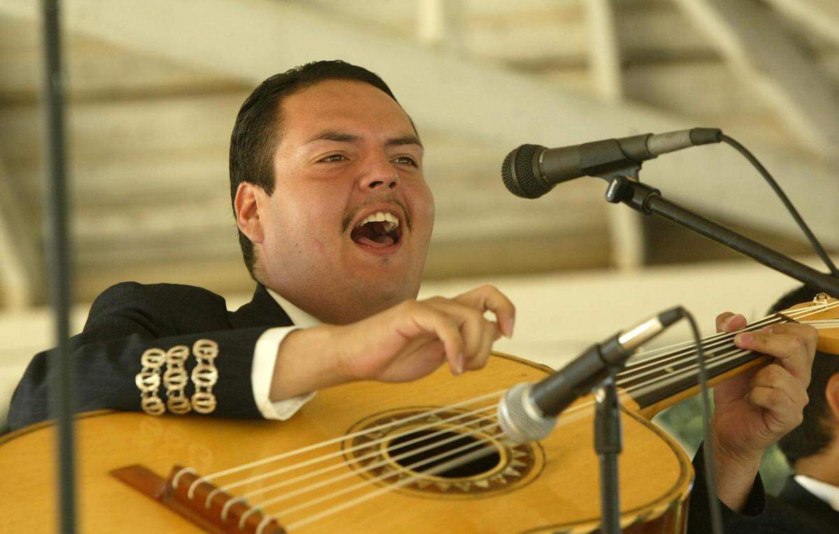 MARIACHI VDA RG 9/12/04 SELMA Scenes from the second annual mariachi festival in Selma. The afternoon event was held at the Pioneer Village and counted on the talents of Mariachi de la Tierra, Mariachi San Joaquin, Mariachi Garibaldi and Mariachi Tenochitlan. Raoul Hernandez on the guitarron and backup vocals for Mariachi Garibaldi.