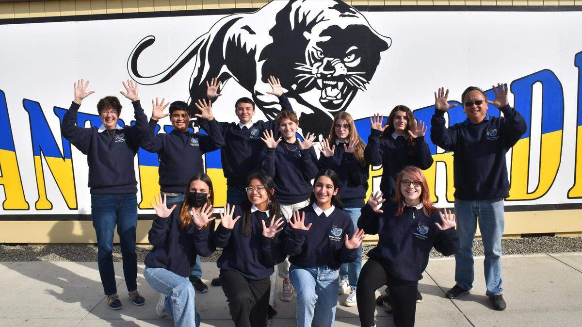 Lemoore Middle College High School academic decathlon team shows 10 fingers up to celebrate winning their 10th Kings County AD competition in a row: Front row, L-R: Gwynith (Gwyn) Champlin, Naeryl Ronquillo, Gurmannat Chalotra, Kodiac (Kodi) Valentino, Back row, L-R: Janet Bengtson (coach), Richard (Isaac) Harmiel, Drevin Rivera, Lana Moore, Clarissa (Chloe) Morgan, Nicolo Wheaton, and Allen Tong (coach).