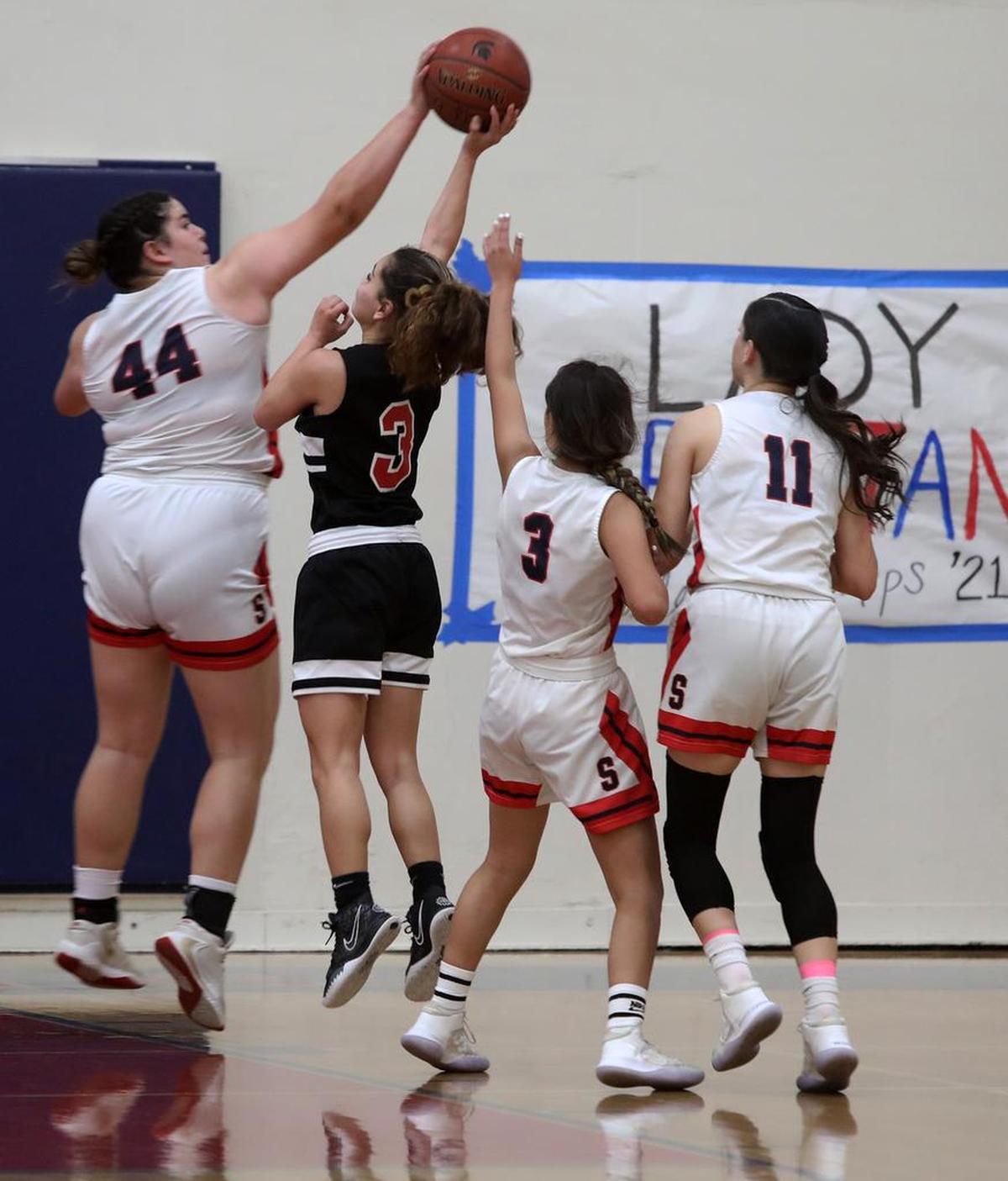 Strathmore High junior Sherrie Chapa blocks a shot by Fallbrook High freshman Alexis Ibarra in a 63-54 win that won the CIF Southern Section Division V-AA championship on June 19, 2021.