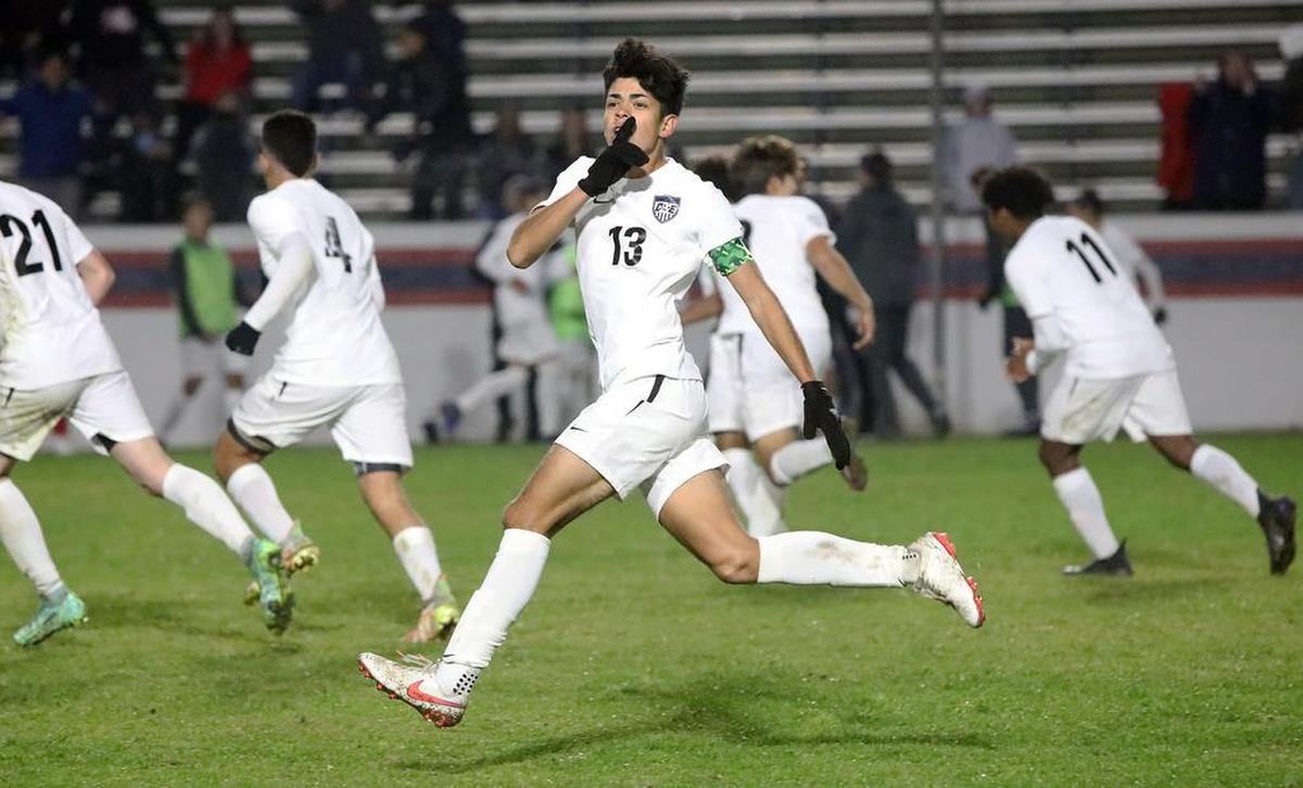Clovis East midfielder Joey Chávez tries to quiet the Sanger crowd at Tom Flores Stadium after scoring the tieing goal in the second half against Sanger High. The home team won 4-3 in overtime.