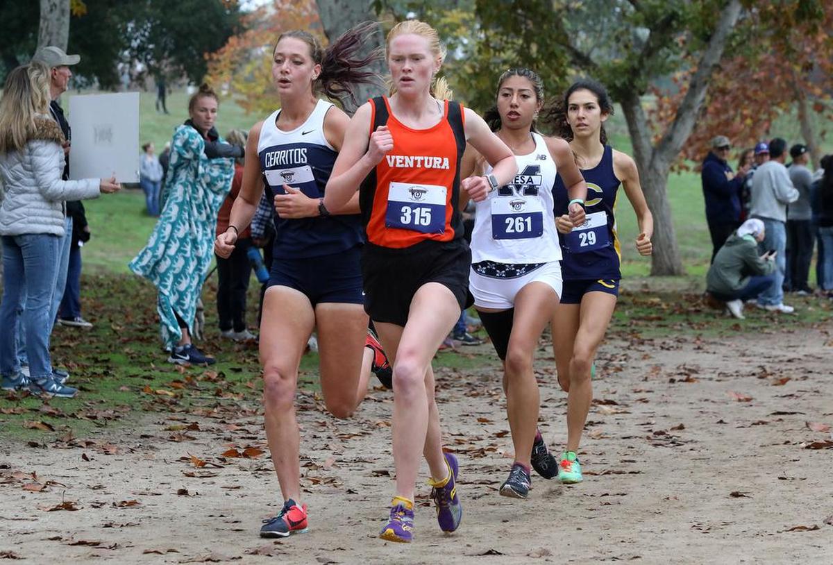 The lead pack of Cerritos freshman Lauren Berg, Ventura freshman Stina Johansson, San Diego Mesa sophomore Yahaira Zuñiga and Canyons freshman Danielle Salcedo approaches the mile mark of the Woodward Park 5-kilometer course during the California Community College state cross country championship on Nov. 20, 2021.Rivers