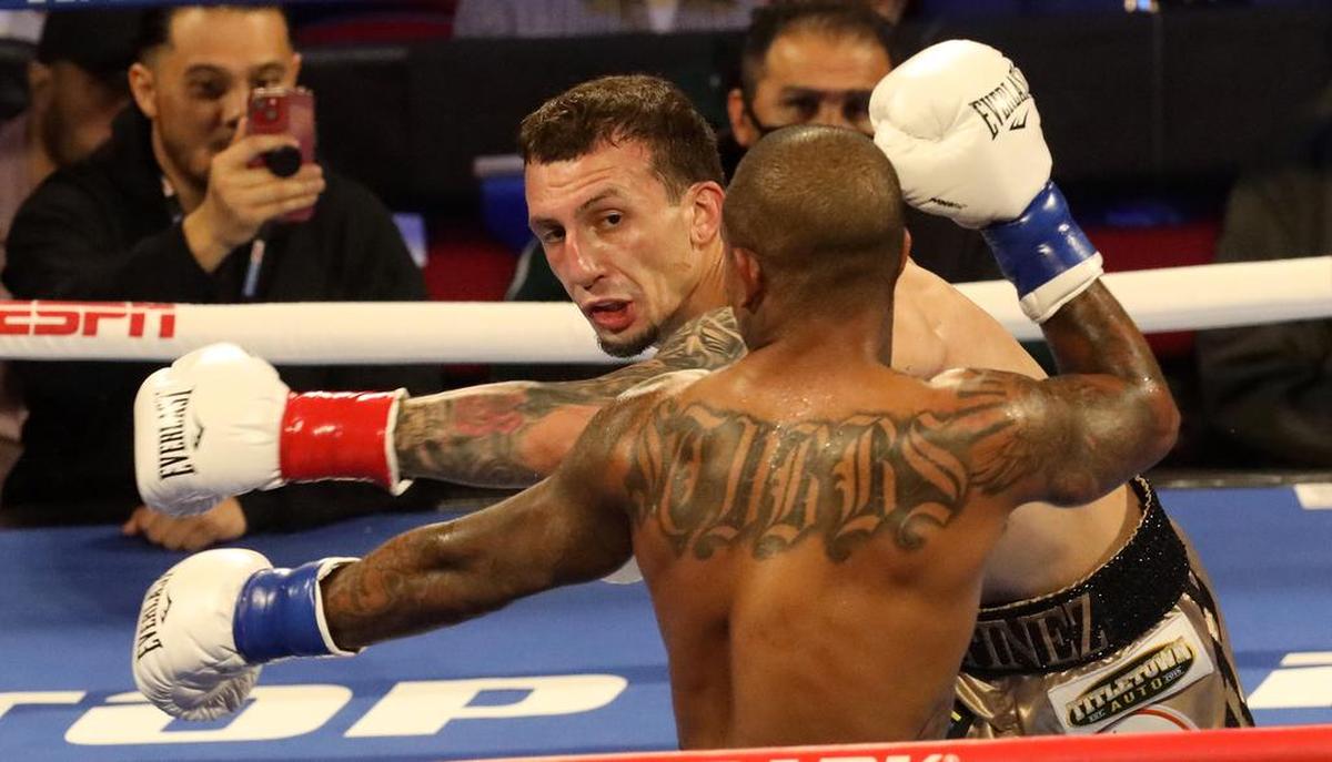Javier Martínez of Milwaukee aims a left punch at Donte Stubbs of Riverside in the second round of a middleweight bout at the Save Mart Center on March 4, 2022. Martínez improved to 6-0 with a unanimous decision in the six-round match.