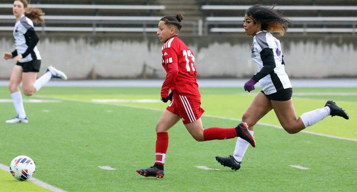 McLane High senior forward Yadira Domínguez breaks away from Desert High defender Chai Currie for her second goal of the match with less than five minutes left in a 6-2 home win in a CIF Central Section Division VI semifinal on Feb. 27, 2023.