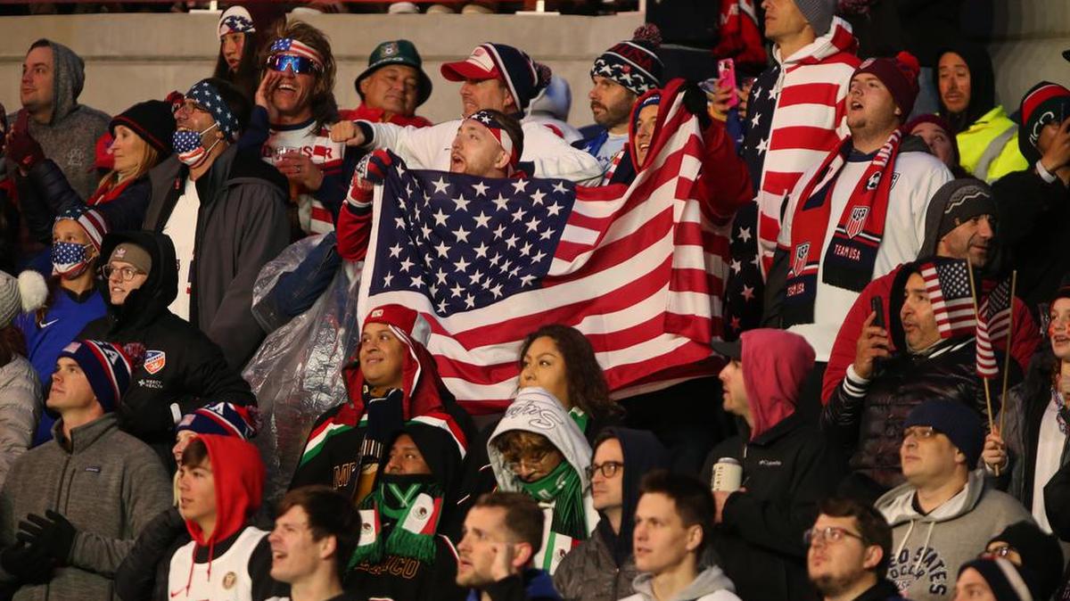 U.S. fans cheer for their team against México during the CONCACAF World Cup Qatar 2022 qualifier soccer match between the USA and México at TQL Stadium in Cincinnati, Ohio.