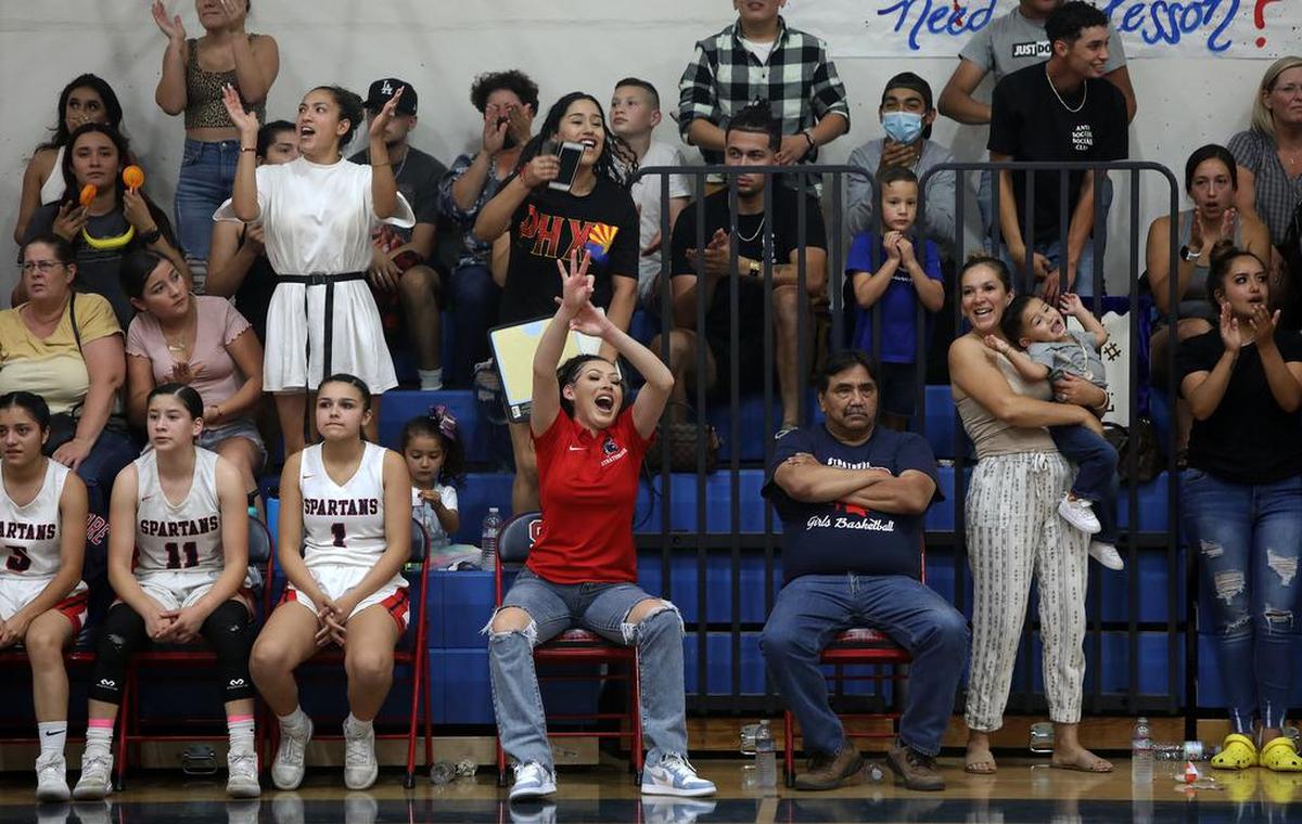 Strathmore High assistant coach Jeidi Gutiérrez cheers a 3-point shot made by Jazmine Soto that gave the Spartans a 49-39 lead with 5 minutes left in the game. Strathmore won the CIF Southern Section Division V-AA title with a 63-54 win on June 19, 2021.