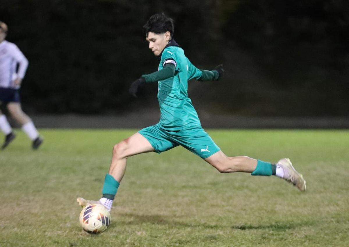 Riverdale High junior captain Sebastián Pérez leads a break against San Joaquín Memorial during a CIF Central Section Division IV boys soccer playoff match at Riverdale. The top-seeded Riverdale Cowboys advanced with a 1-0 win to improve to 18-4-4.