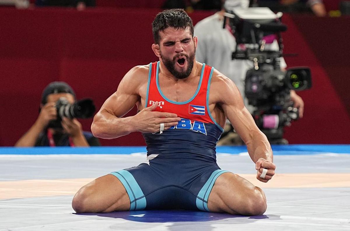 Luis Alberto Orta Sánchez of Cuba celebrates winning against Kenichiro Fumita of Japan in the men’s Greco-Roman 60kg final match during the wrestling events of the Tokyo 2020 Olympic Games.
