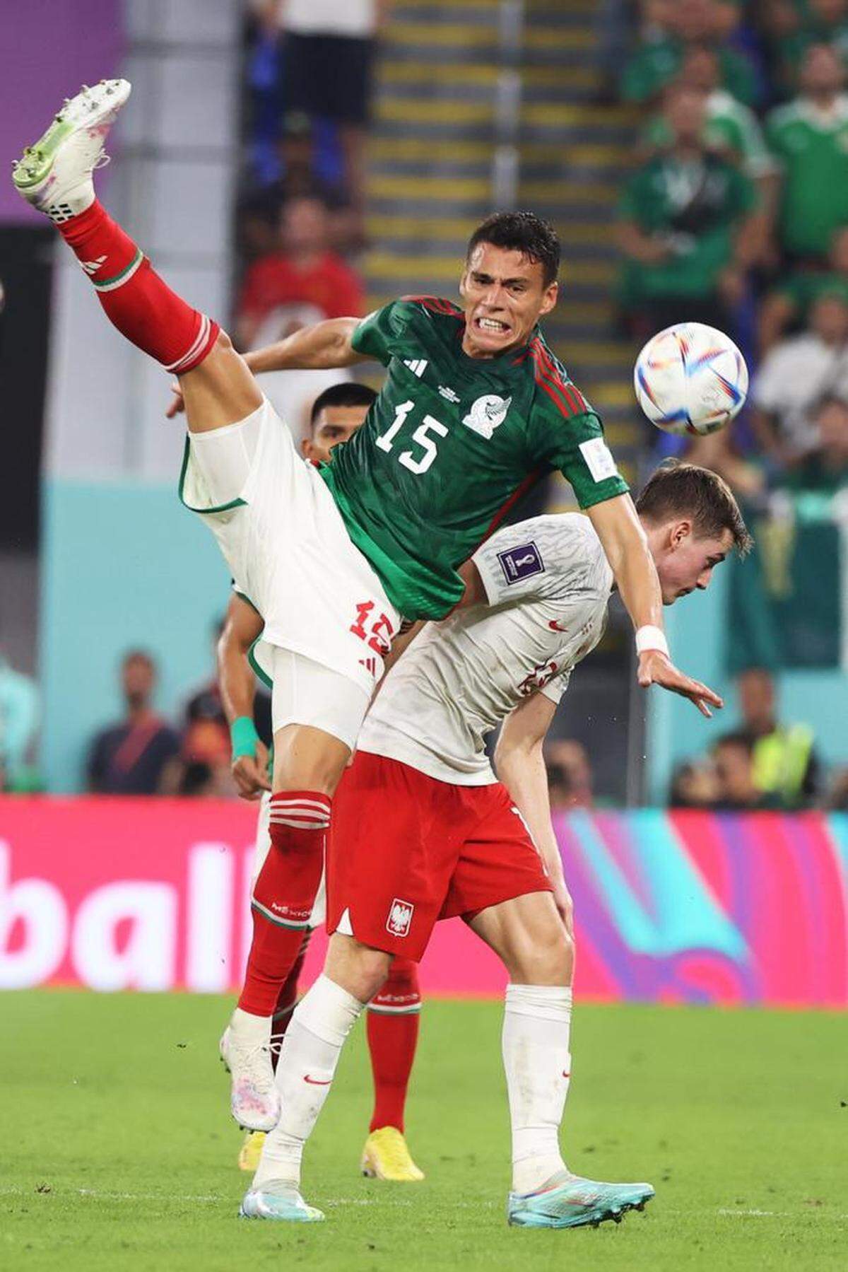 Héctor Moreno of México (L) in action against Jakub Kaminski of Poland during the FIFA World Cup 2022 group C soccer match between México and Poland at Stadium 947 in Doha, Qatar.