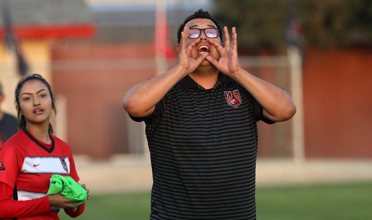 Kerman High coach Rubén Cardona yells for a substitution during a Northern California Division IV regional match on March 1, 2022.