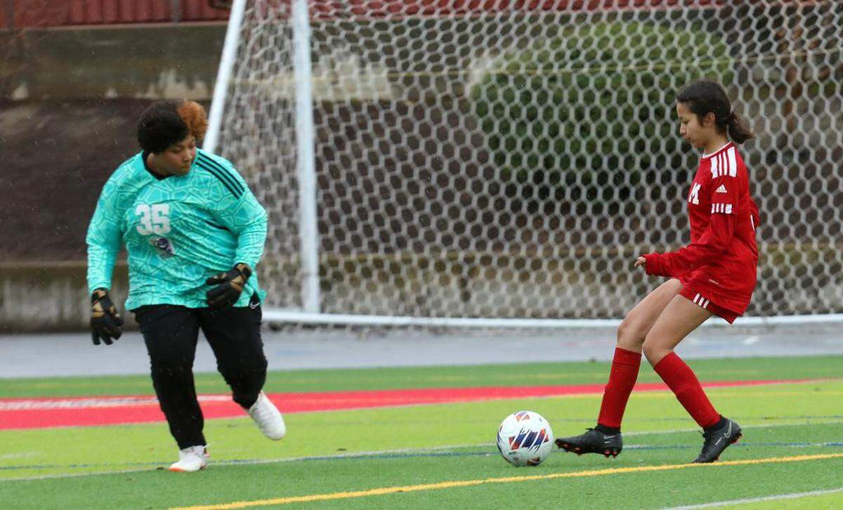 McLane High sophomore Celeste Thahane got past Desert High goalkeeper Jie Garner for a score during a 6-2 win at home against Desert High in a CIF Central Section Division VI semifinal on Feb. 27, 2023.