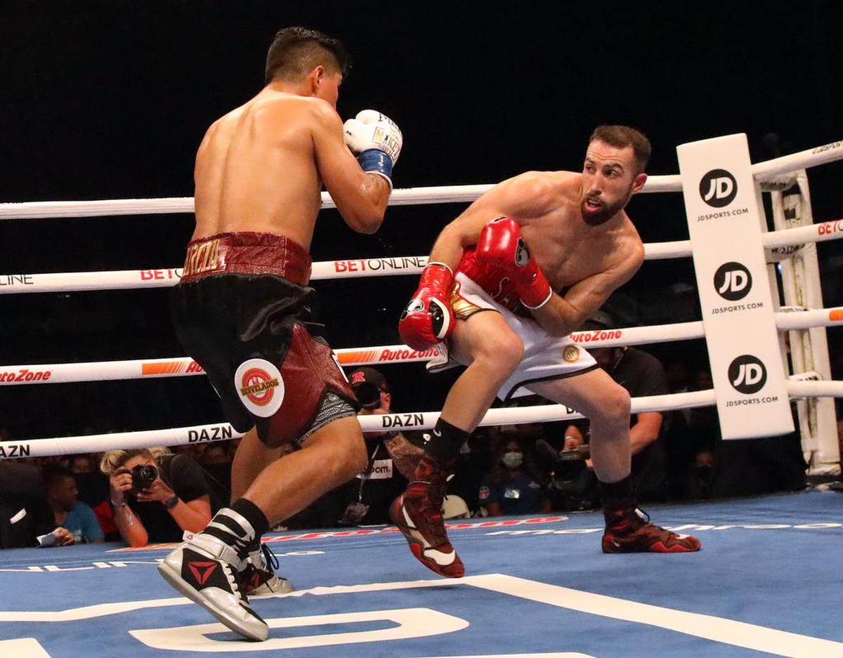 Sandor Martín of Barcelona, Spain tangles with Mikey García during their 10-round welterweight bout at Chukchansi Park on Oct. 16. 2021. Martín scored a split decision win over the four-time world champion in a shocking result. Martín improved to 39-2; García, from Oxnard, dropped to 40-2.