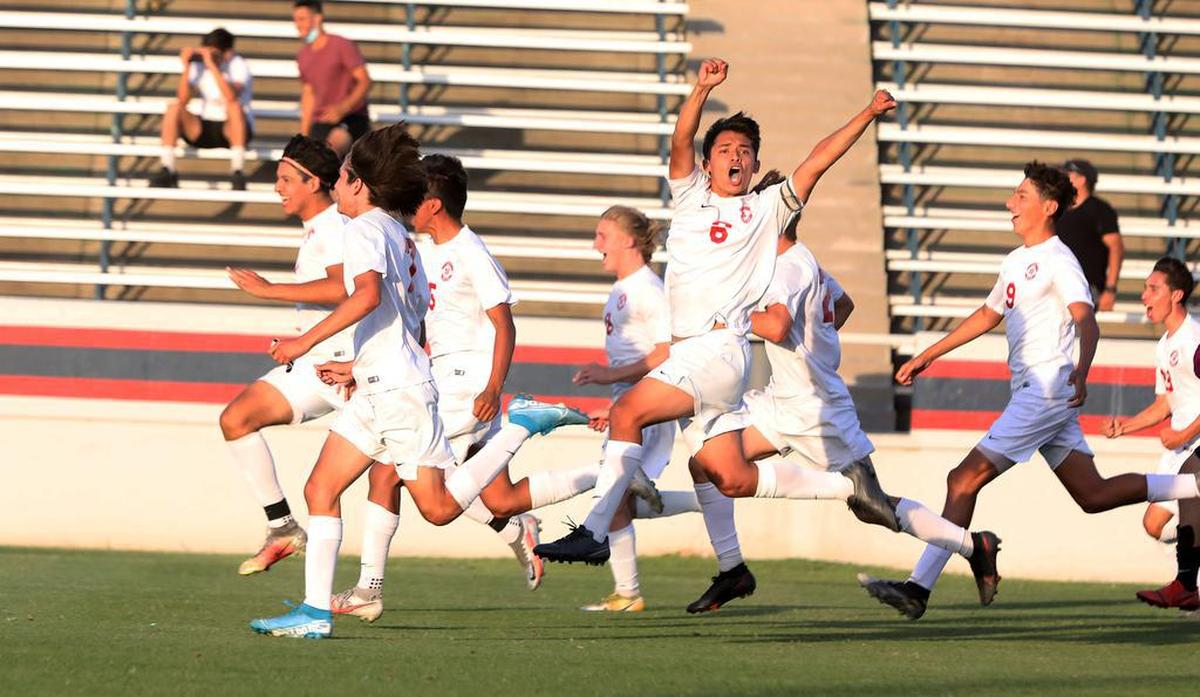 Hart High junior Sebastián Ramírez (No. 6) and his teammates storm onto the field after knocking host Sanger High out of the Southern California CIF Division II quarterfinals, 2-2 (4-3 penalty kicks) on June 1, 2021..