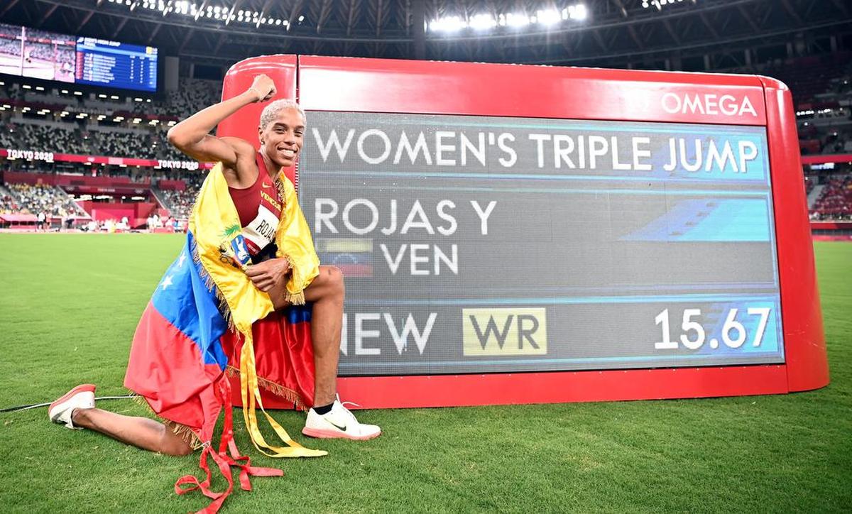 Gold Medalist Yulimar Rojas of Venezuela poses with her new World Record after the Women's triple jump final during the Athletics events of the Tokyo 2020 Olympic Games at the Olympic Stadium in Tokyo, Japan.