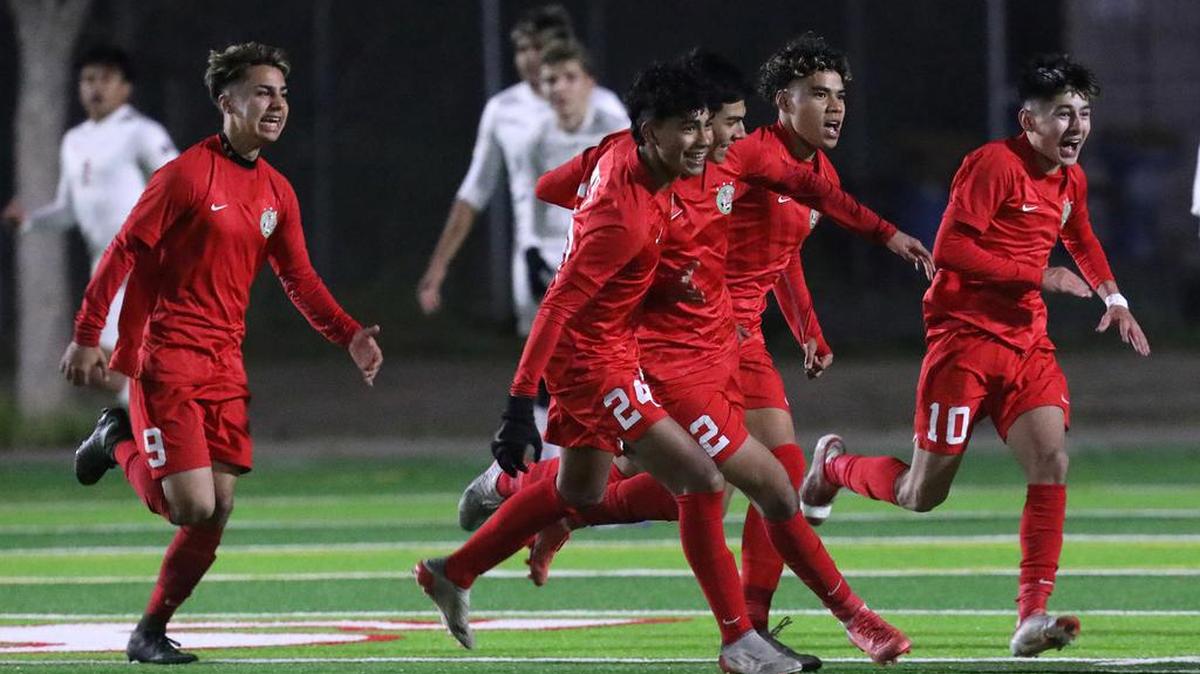 Lindsay High players celebrate a first-half goal against Kerman High in a CIF Central Section Division III semifinal match on Feb. 23, 2022.